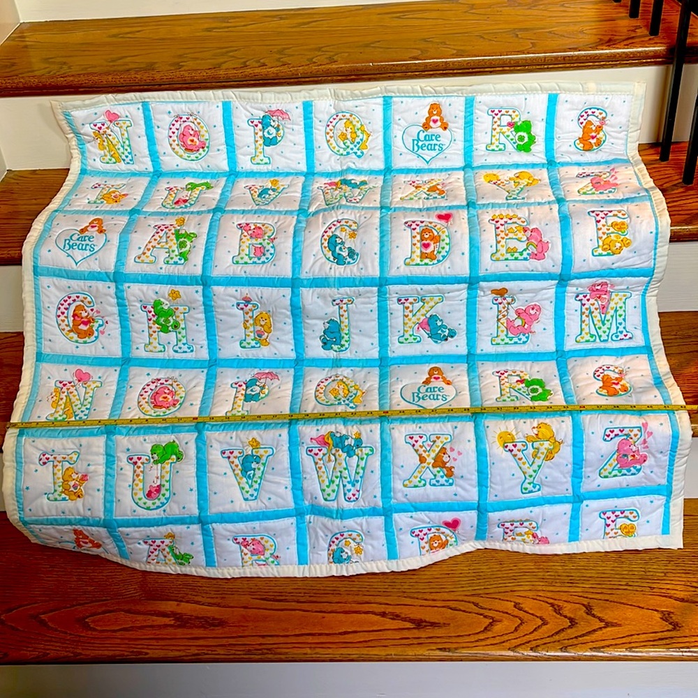 CARE BEARS VINTAGE QUILTED BABY BLANKET. 42” wide x 39” long. A B C’s